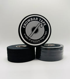 Two 4-pack rolls of black Crowbar Tape stacked on a light gray background, with a tin standing upright to show the black-and-white circular label that reads 'CROWBAR TAPE' and '4 rolls of premium finger tape '.